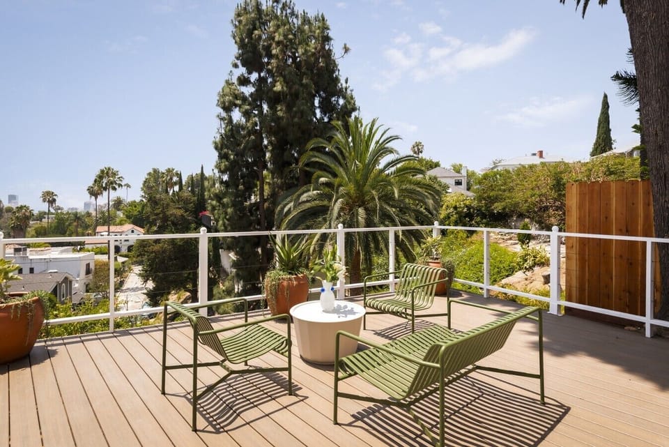 Private deck surrounded by lush palms, the perfect spot to relax outdoors