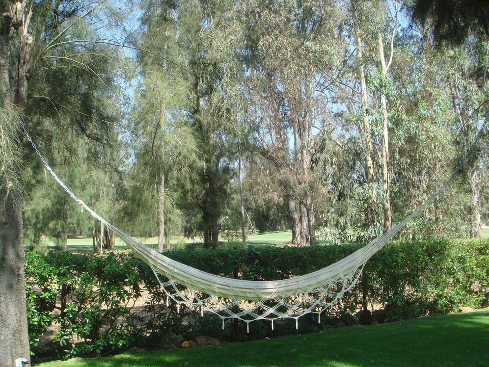 Garden  - Golf View| Brazilian Hammocks are a must for reading or napping in the shadow