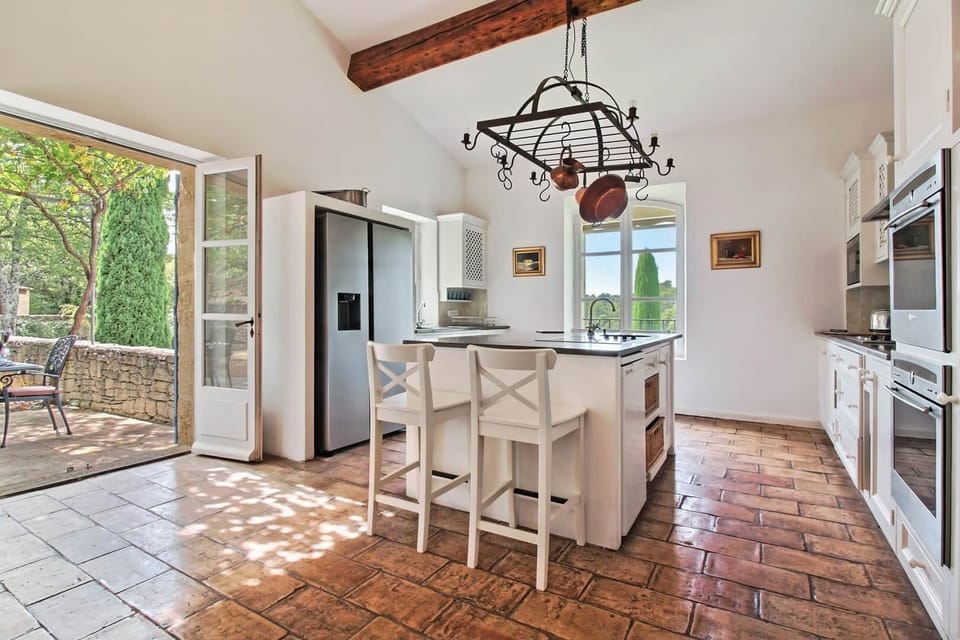 Kitchen leads to terrace for al fresco dining