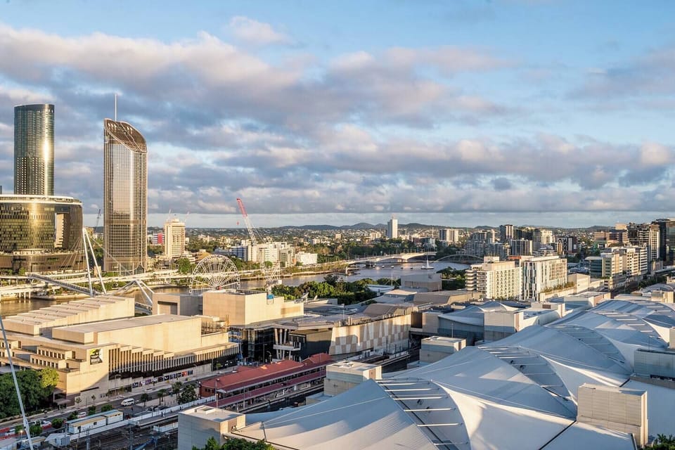 Views from the balcony extend across beautiful Brisbane city and the winding river.