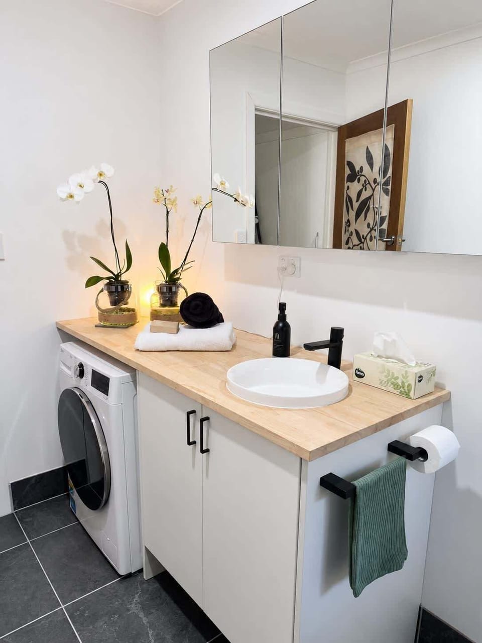 European laundry tucked neatly into the modern bathroom. Now with clothes dryer.