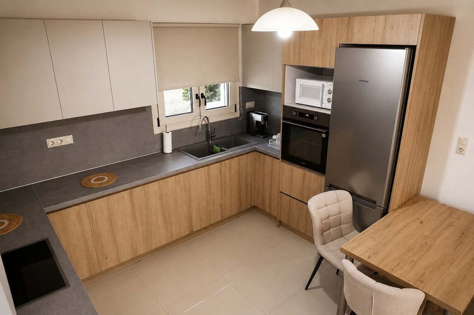 Modern kitchen with dining space and practical amenities.