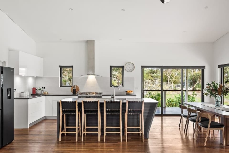 Pull up a stool at the kitchen island, where casual breakfasts, grazing platters and cooking moments become part of the experience.