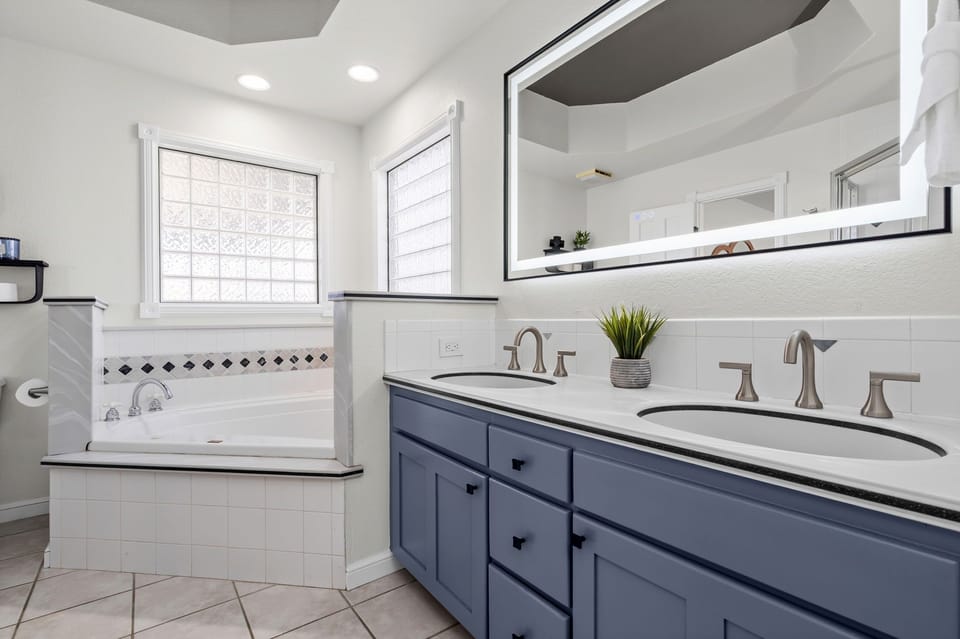 Bathroom 1 | Ensuite Bath with Walk-in Shower and Soaking Tub (main level)
