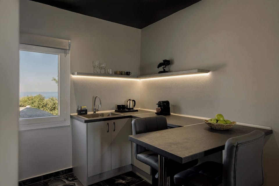 Well-equipped kitchenette with coffee essentials and space for light meals.