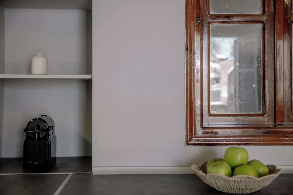 Clean kitchen space with simple amenities for preparing light meals.