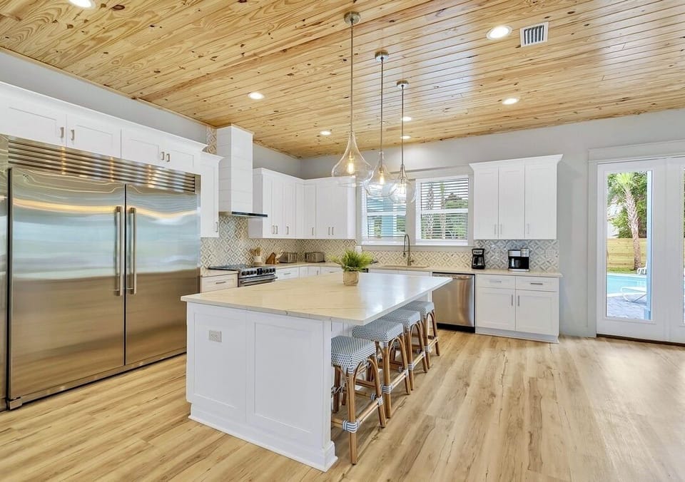 1st Floor - Fully stocked gourmet chef’s kitchen featuring a commercial-size refrigerator, gas range, oversized island, and everything needed to prepare meals for large groups. The heart of the home for cooking, gathering, and entertaining.