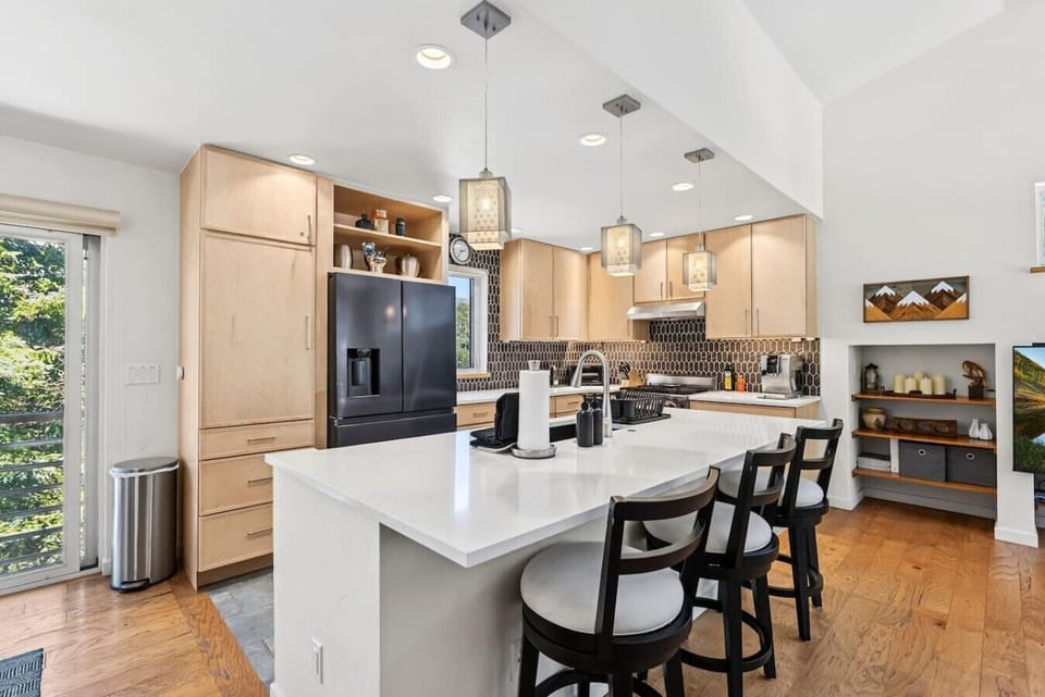 Fully equipped kitchen with island and bar seating