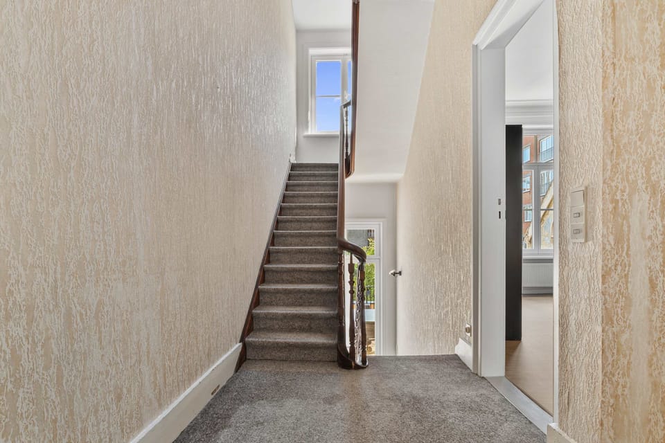 Hallway and staircase connecting the floors of the spacious townhouse – Grand Ostend home with private sauna, near Oostende beach and centre