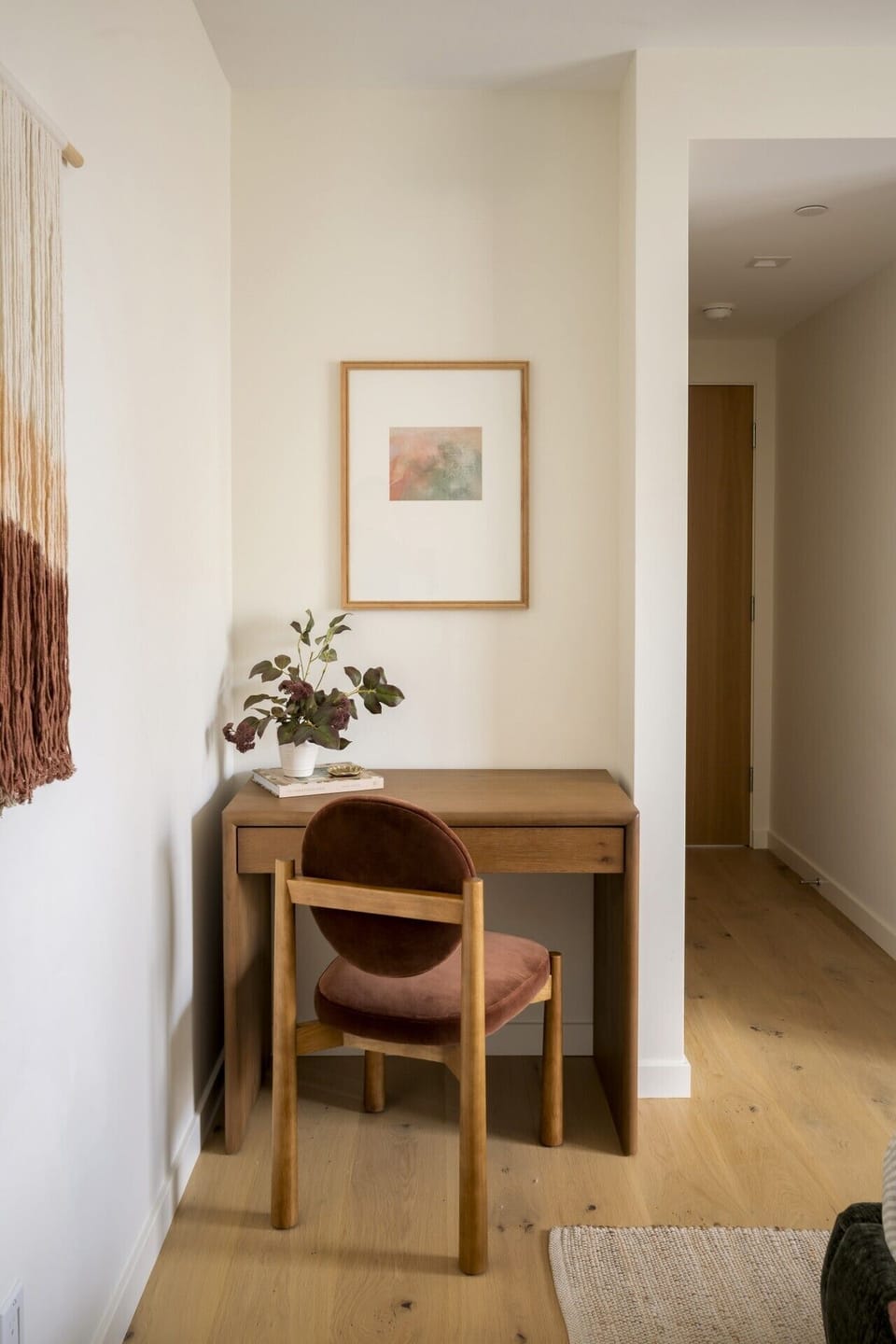 A dedicated workspace tucked within the primary bedroom offers a quiet spot to catch up on emails or work remotely, thoughtfully positioned without taking away from the room`s restful feel.
