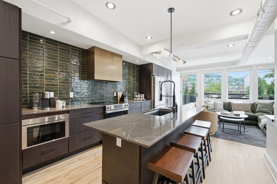 Fully Stocked Kitchen (Open to Living Room & Roof Top Deck)
