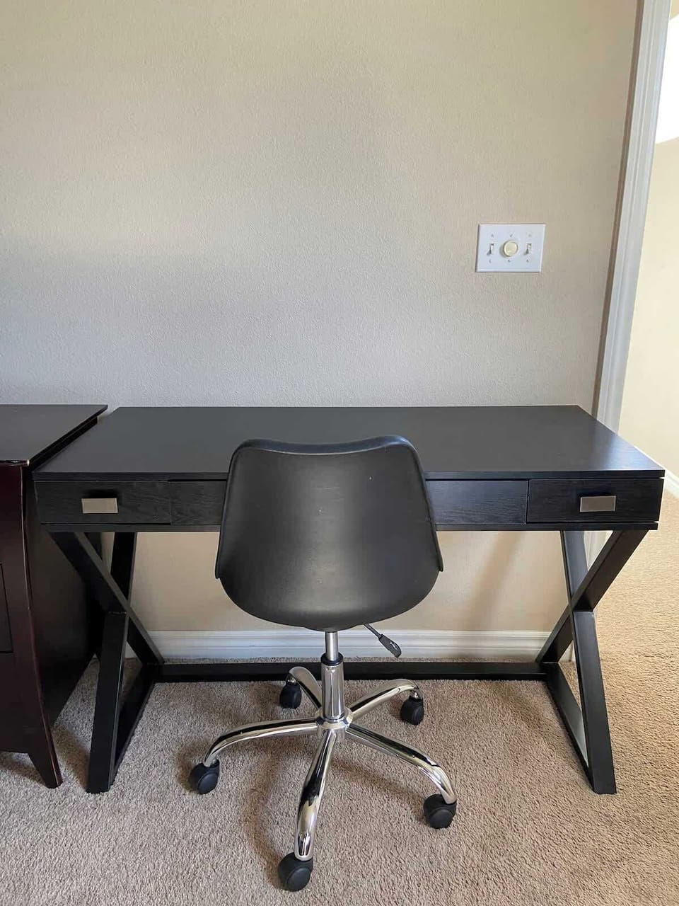Upstairs Primary Bedroom: Includes a comfortable work desk area, perfect for guests needing a quiet space.