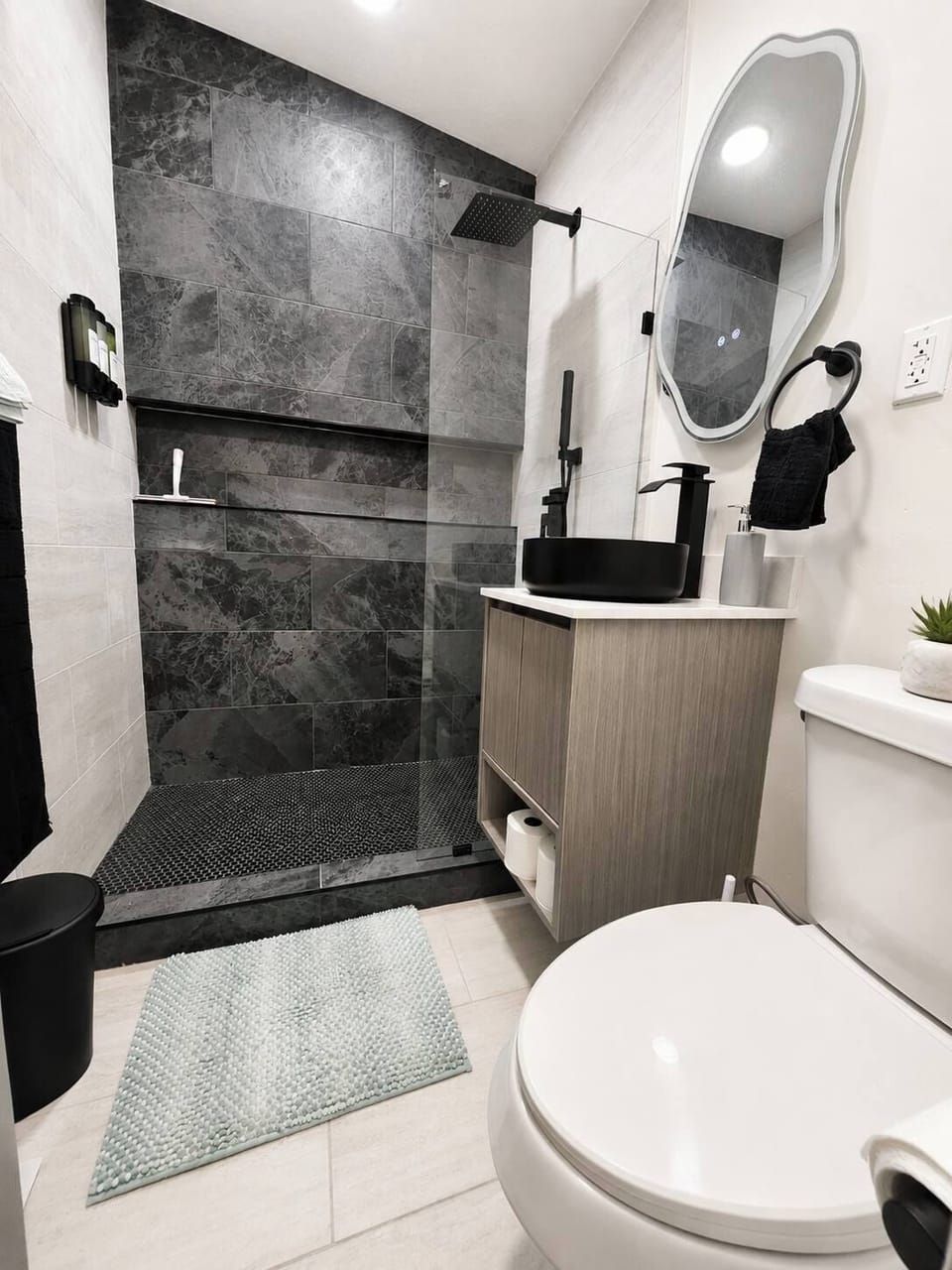 Spa-inspired walk-in shower with sleek modern finishes.