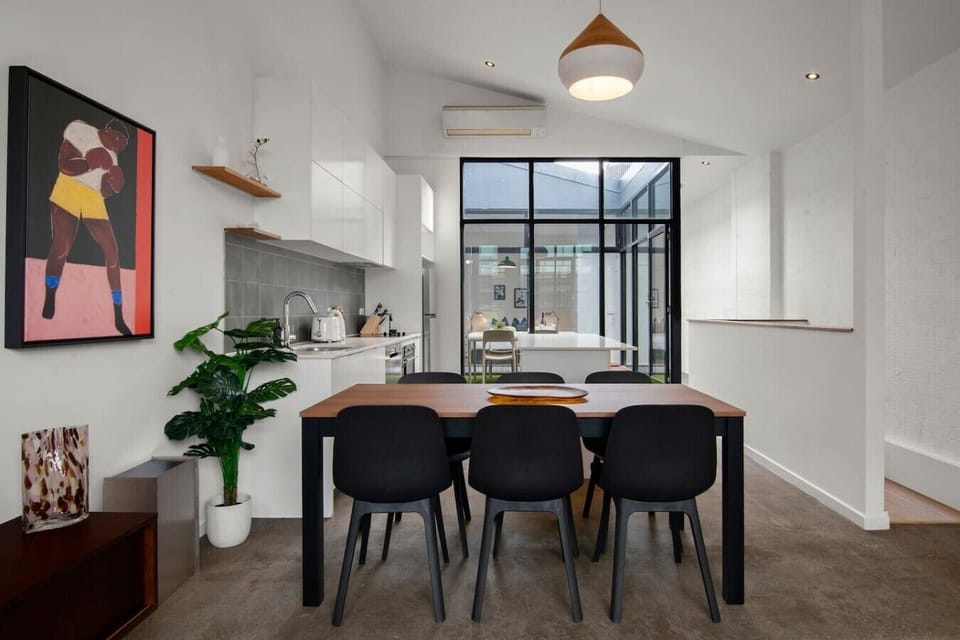Sit down with the whole group to enjoy a meal at the funky dining area