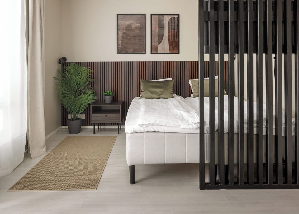 Modern, light-filled bedroom with chic wood accents and cozy design
