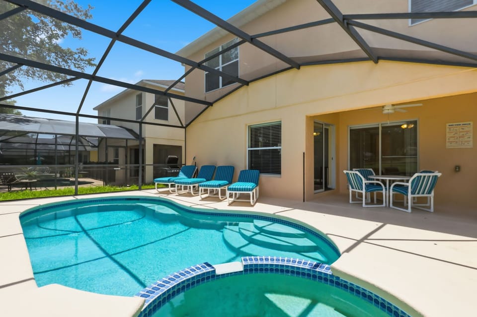 Your private screened pool and spa—perfect for cooling off after a day at the parks.