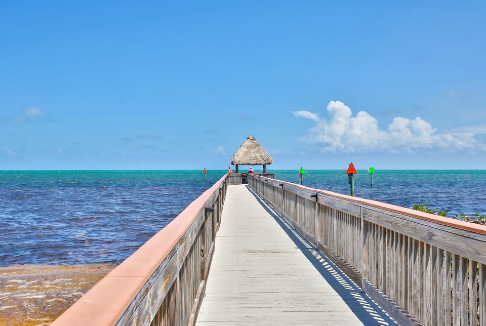  Walk the pier, feel the breeze, and find your spot under the tiki hut — this is Florida living at its best