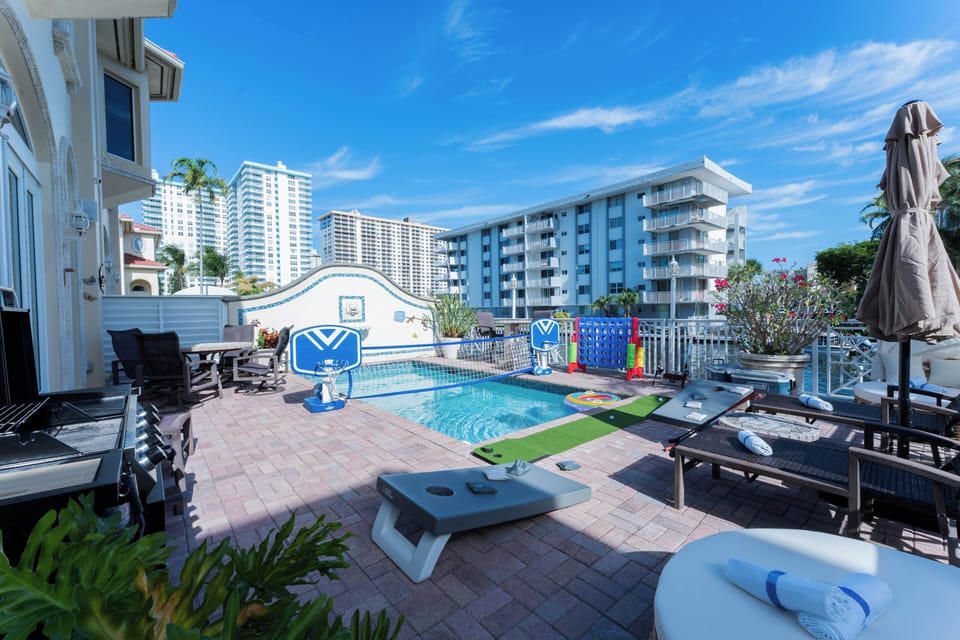 Resort-style patio blends outdoor lounging with direct pool access.
