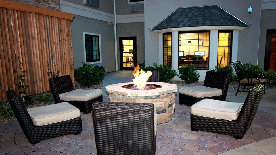 Gather around the outdoor fire pit on a Kansas evening — a good spot to wind down after exploring Wichita