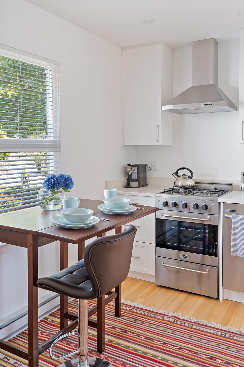 Functional kitchen layout designed for daily meal preparation with overhead cabinet storage.