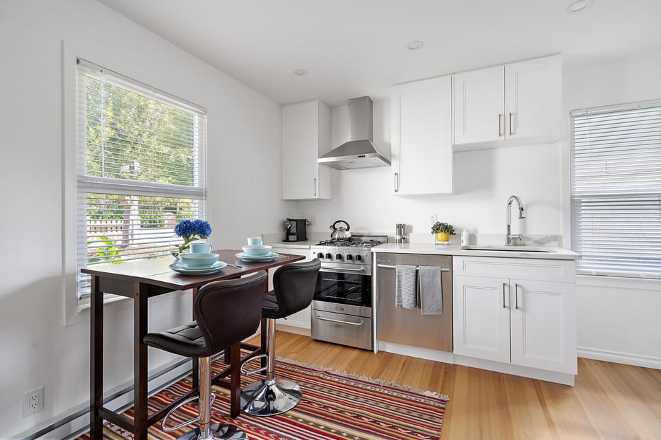 Compact dining setup right off the kitchen, perfect for quick morning breakfasts or working from home.