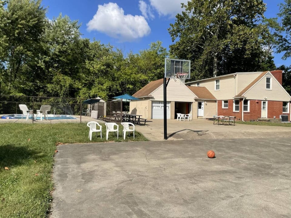 Courtyard, pool, and picnic area from the adjacent basketball court. Easy access to Event Room for indoor-outdoor entertainment.