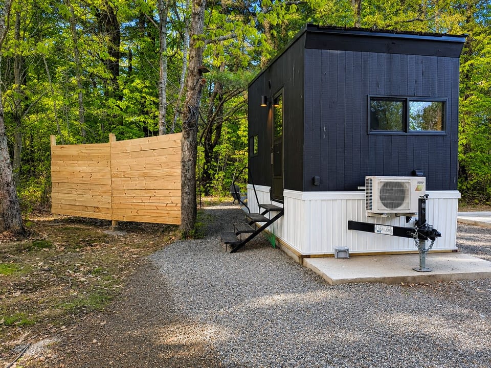 Modern tiny home retreat with wooded privacy and a serene setting