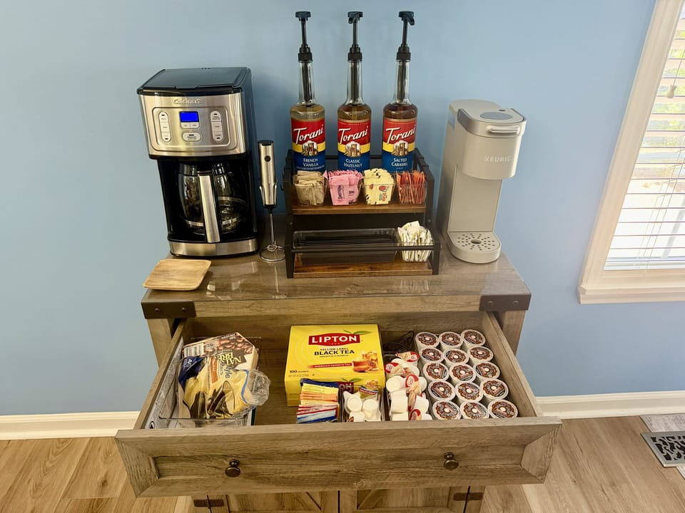 Fully stocked coffee bar and bar essentials.