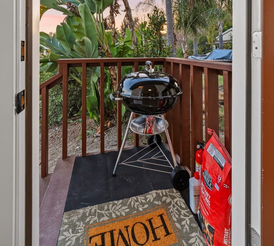 Private patio with a BBQ grill for outdoor dining and relaxing.