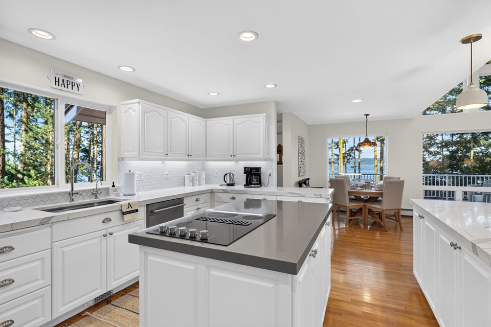 Functional wrap-around countertop design offering premium prep space and seamless integration with the living zones.
