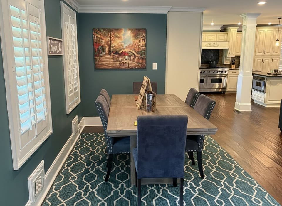 Gather around this inviting dining table for memorable meals and lively conversation, perfectly flowing into the spacious kitchen.