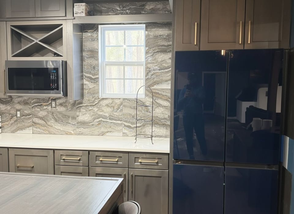 Whip up delicious meals in this sleek, modern kitchen, fully appointed so you can enjoy cooking and gathering with ease.