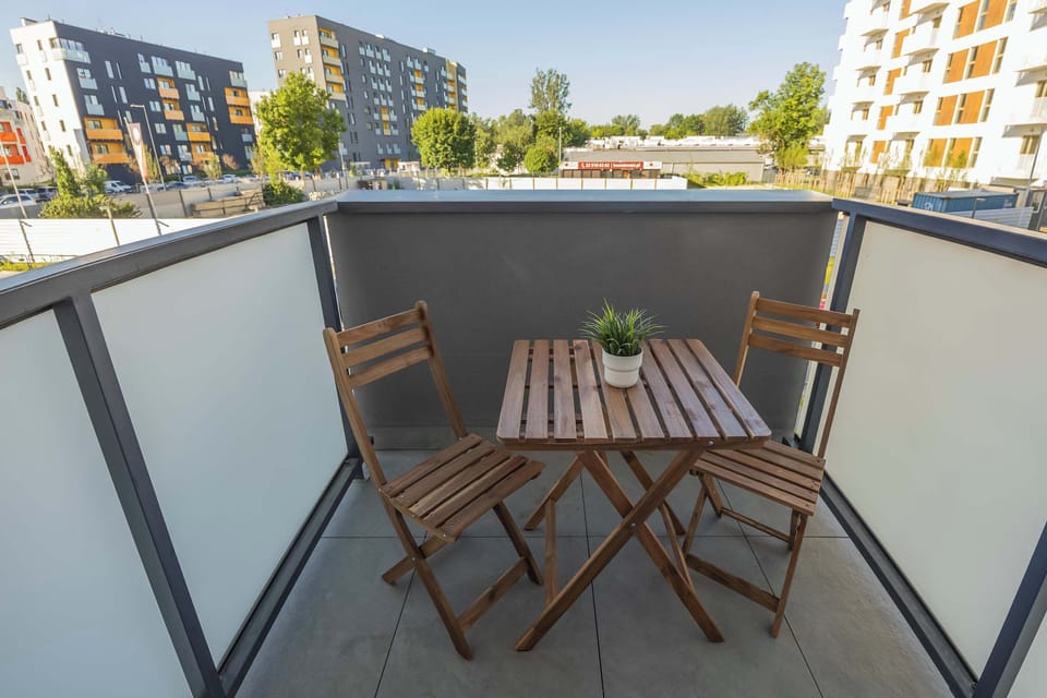 Private balcony with outdoor seating area.