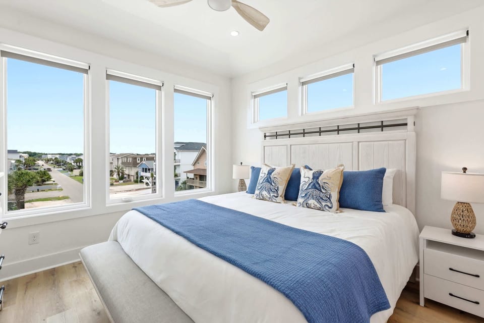 Primary suite featuring a luxurious king bed.