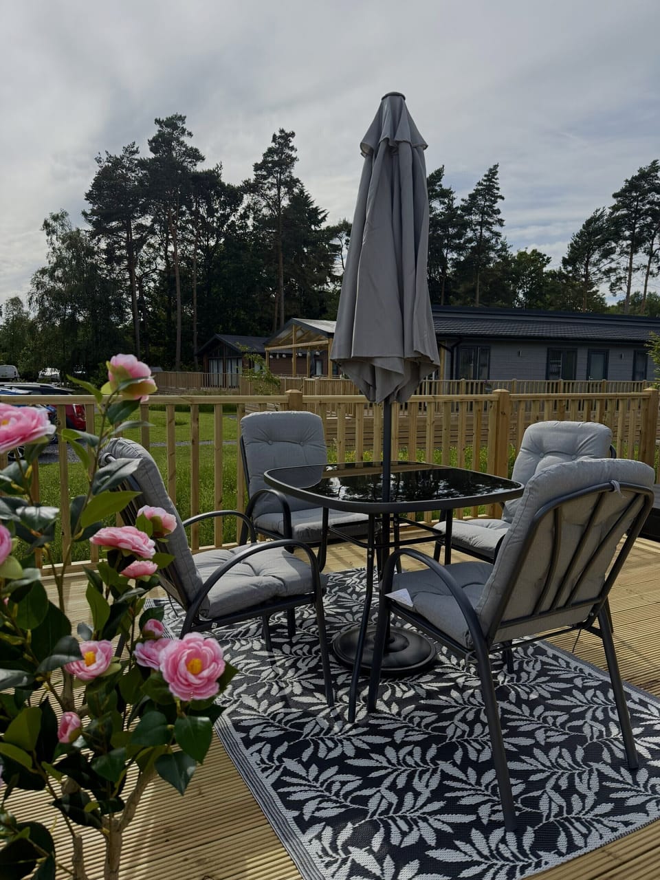 A spacious outdoor decking area perfect for relaxing and enjoying the fresh air during your stay.