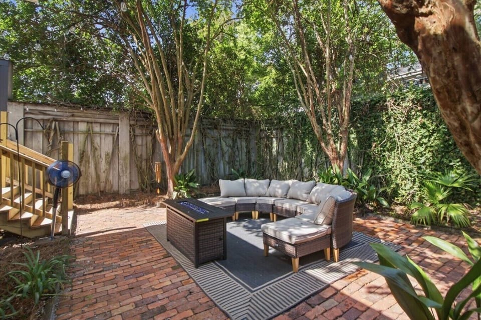 Curated Al Fresco Living: Our premium courtyard lounge is grounded by an 8`x10` charcoal-braided outdoor rug, offering a highly comfortable, resort-standard social retreat.
