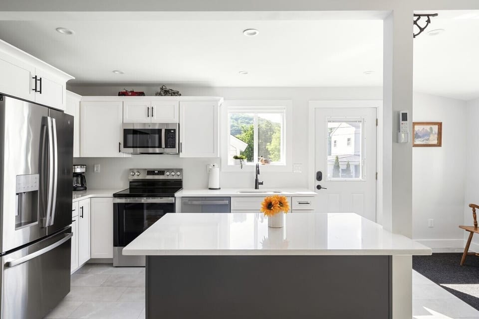 A warm, open-plan kitchen fully stocked with all the basics you need.