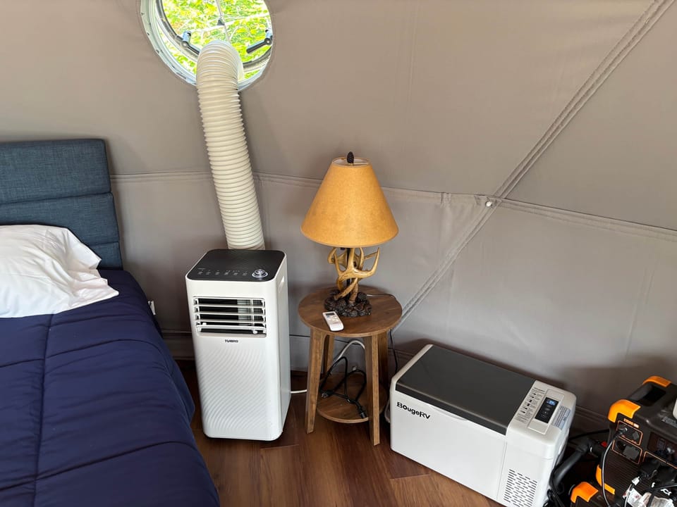 AC, night stand and lamp, refrigerator. power station