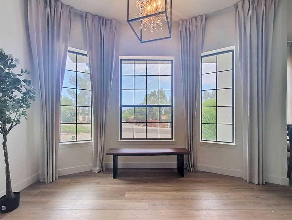 Leave the drapes half-drawn, Claim this chair before anyone else wakes up — early morning coffee, the desert light coming in, and the whole house to yourself.let the Arizona afternoon light filter in soft, and let the day slow down.