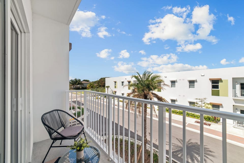 Private balcony with peaceful neighborhood views.