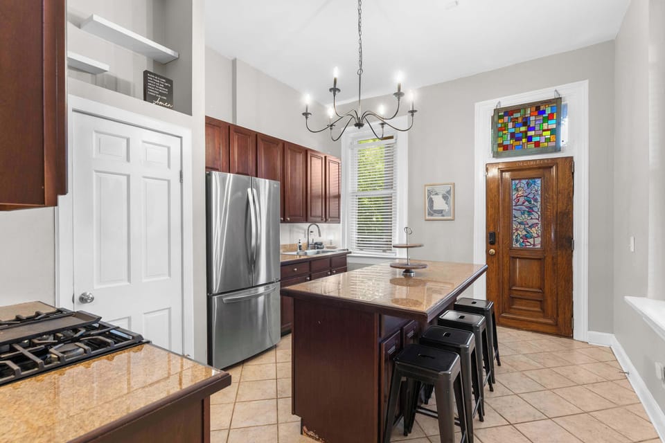 This spacious kitchen is fully equipped with everything you need, from quick breakfasts to family dinners around the island.