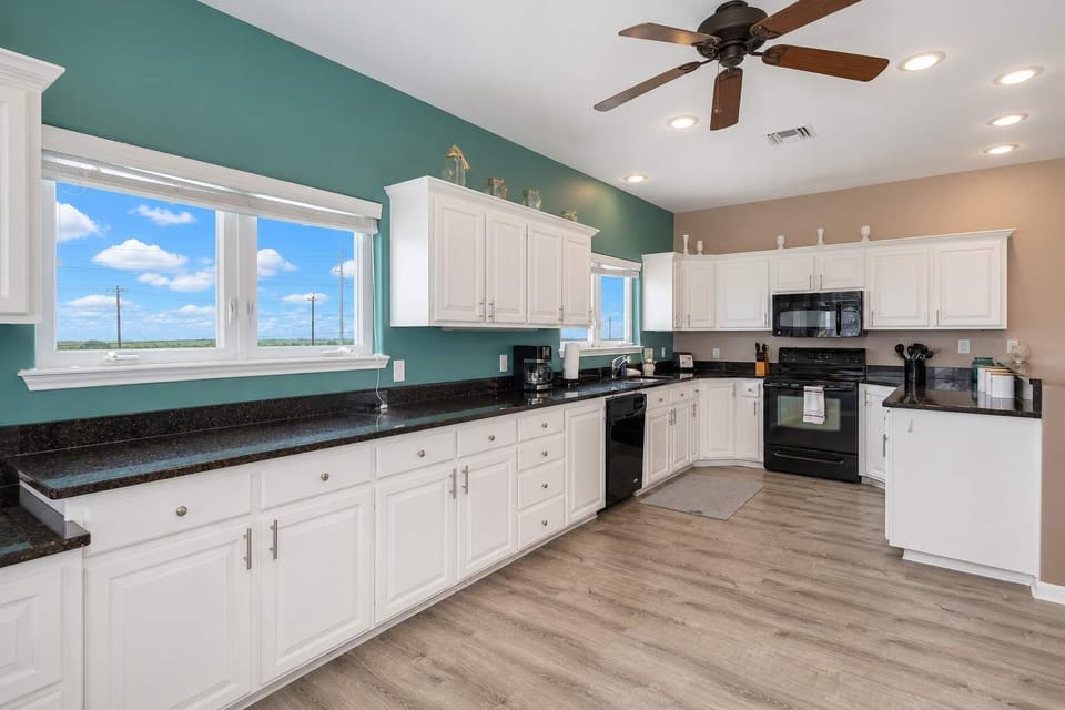 Cook in Style – This kitchen features high-end appliances, ample storage, and everything you need for a seamless culinary experience.