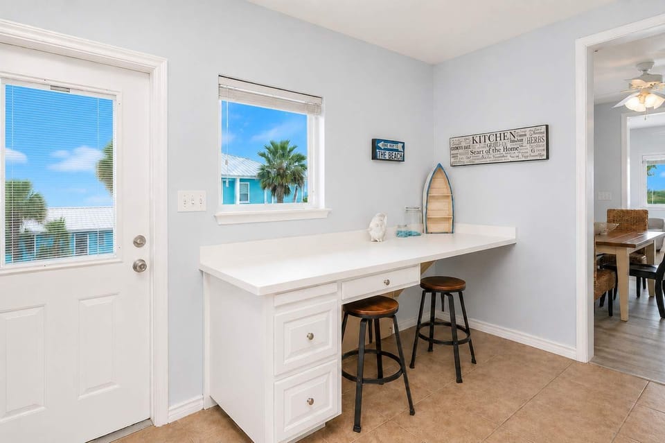 A sleek built-in counter with seating is perfect for morning coffee, quick snacks, or catching up on messages before the day begins.