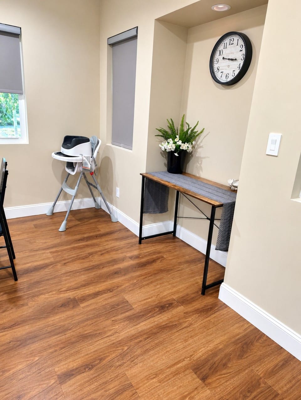A convenient workspace just off the dining area, perfect for catching up on emails or remote work, with a high chair available for families traveling with little ones.