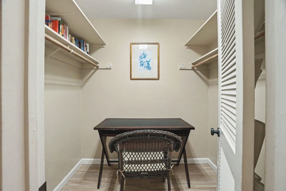 Your private workspace awaits, tucked into this bright nook with shelving for your books and belongings, plus a quiet desk setup for staying productive during your stay.