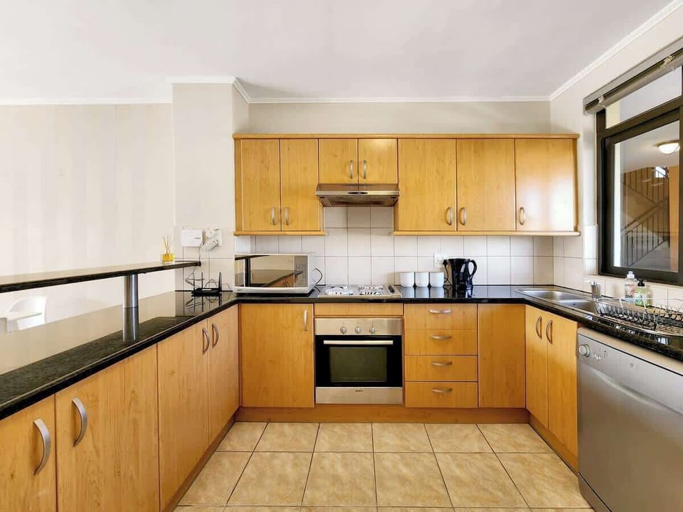 As you enter the  apartment you will find the kitchen to your right. It is equipped with everything you need. Fridge, freezer, dishwasher, oven, stove, hob, microwave, coffee, tea, sugar, milk, salt, pepper, coffee plunger, cutlery. 