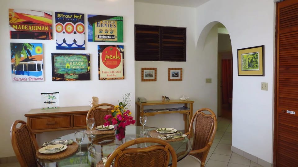Gather for laid-back meals surrounded by colorful island art.