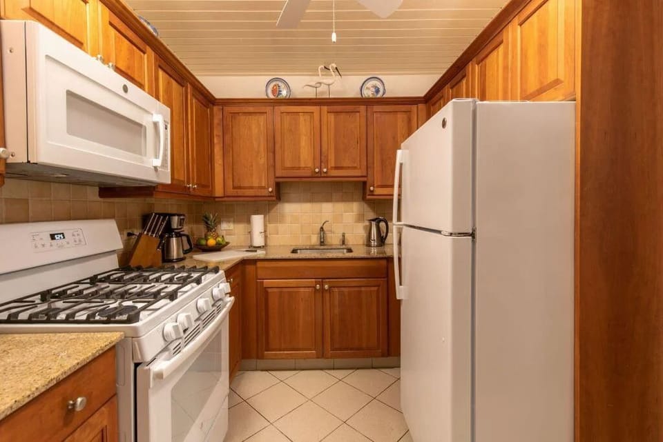Cook effortlessly in a warm, fully equipped kitchen space.