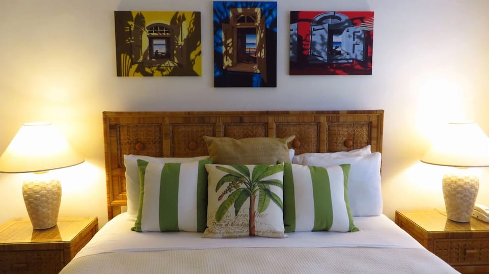 Drift into plush comfort beneath charming art and soft lighting.