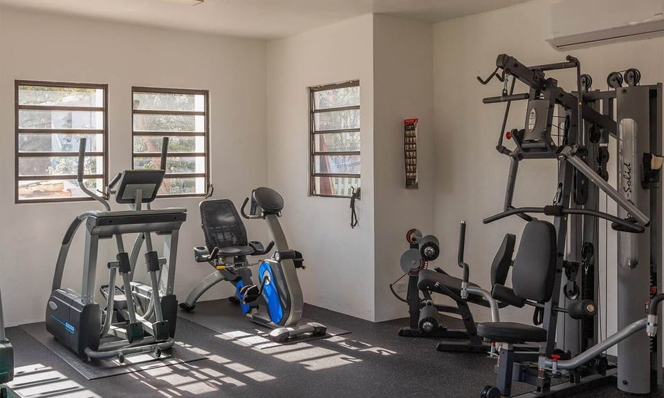 Recharge your energy with a bright, well-equipped fitness room.